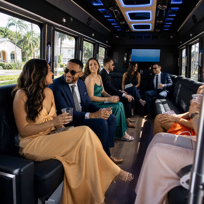 Wedding guests seated inside a Coral Gables party bus