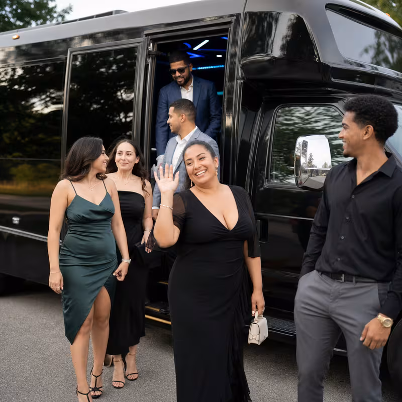 Passengers loading luggage while boarding an Coral Gables group shuttle