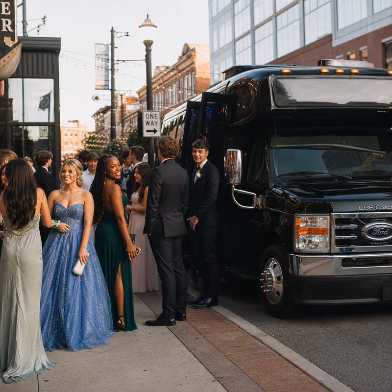 Passengers loading luggage while boarding an Coral Gables group shuttle