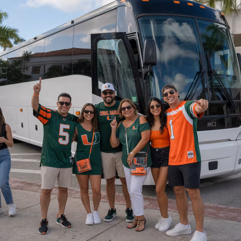 Passengers loading luggage while boarding an Coral Gables group shuttle