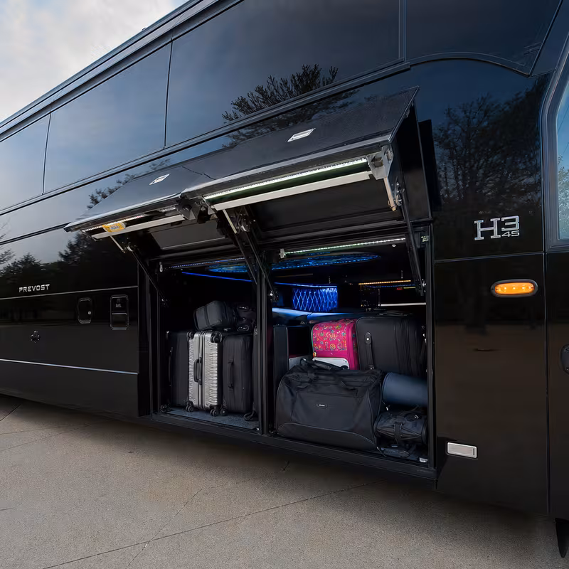 Party bus interior with wraparound leather seating and LED lighting in Coral Gables