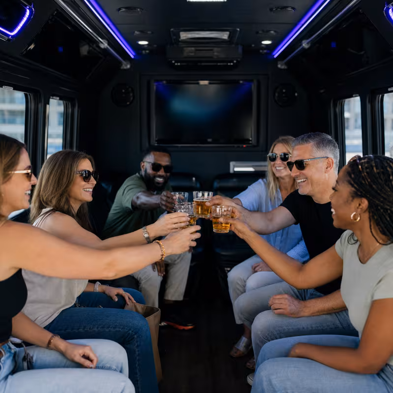 Group boarding a white charter bus for Winery & Brewery Tour Transportation transportation in Coral Gables